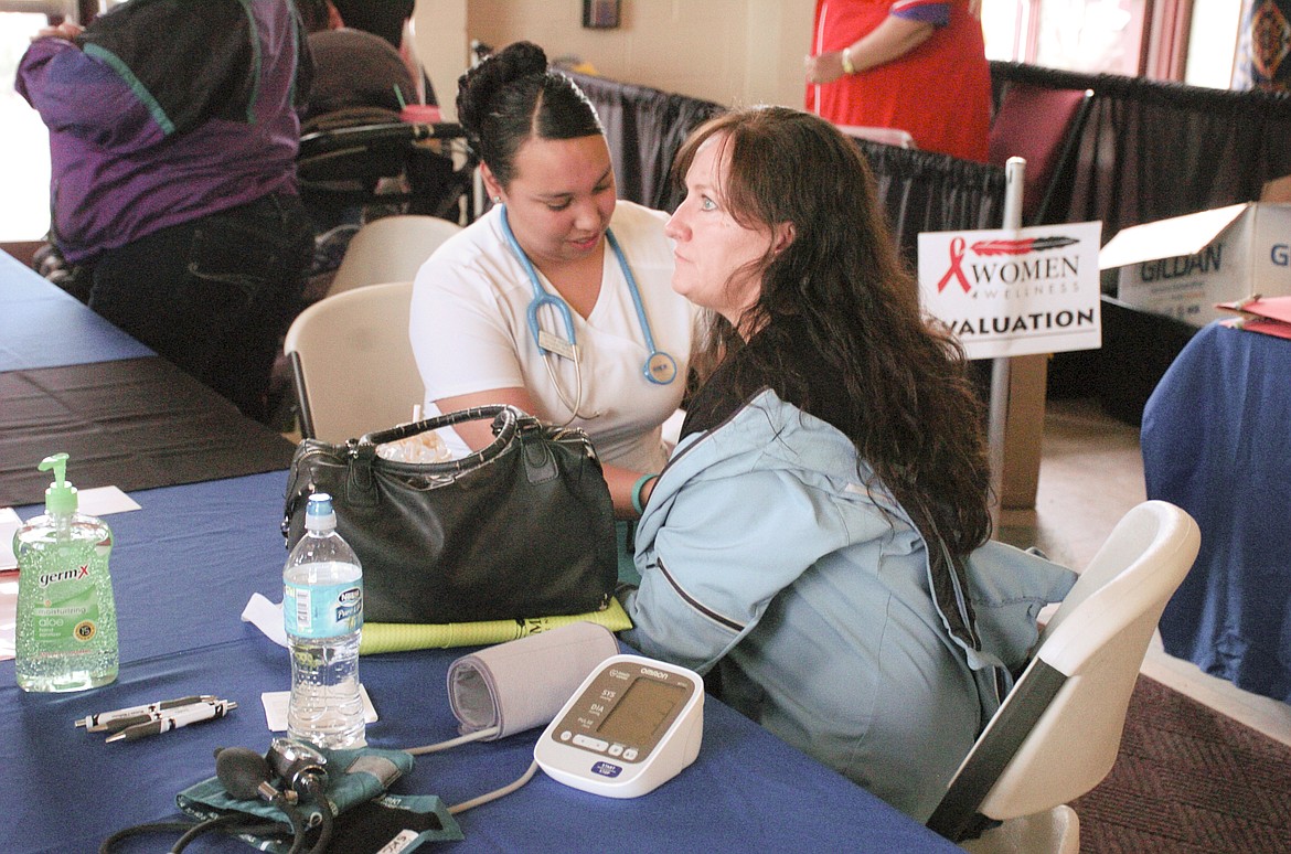 Students at the Salish Kootenai College Nursing program checked the vitals of visitors during the Women 4 Wellness Health Fair on May 18. (Brett Berntsen/Lake County Leader)