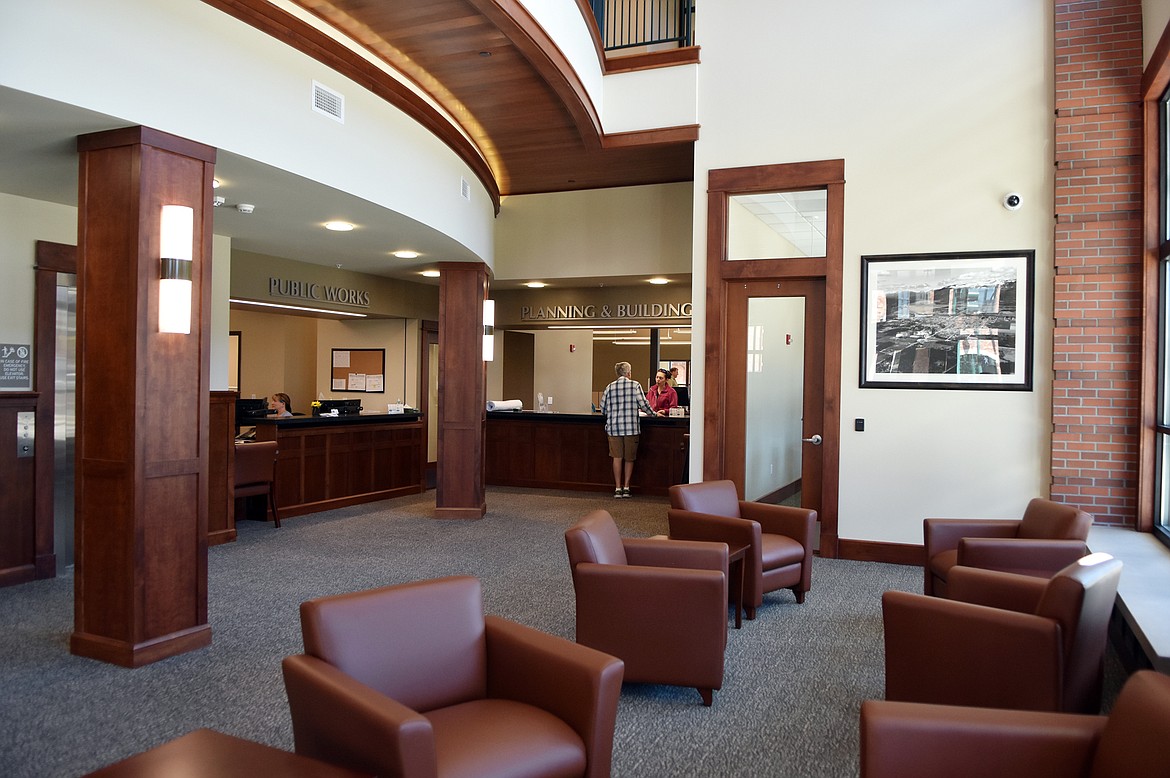 A customer gets assistance in the lobby of the the new Whitefish City Hall, which opened Monday morning. (Heidi Desch/Whitefish Pilot)