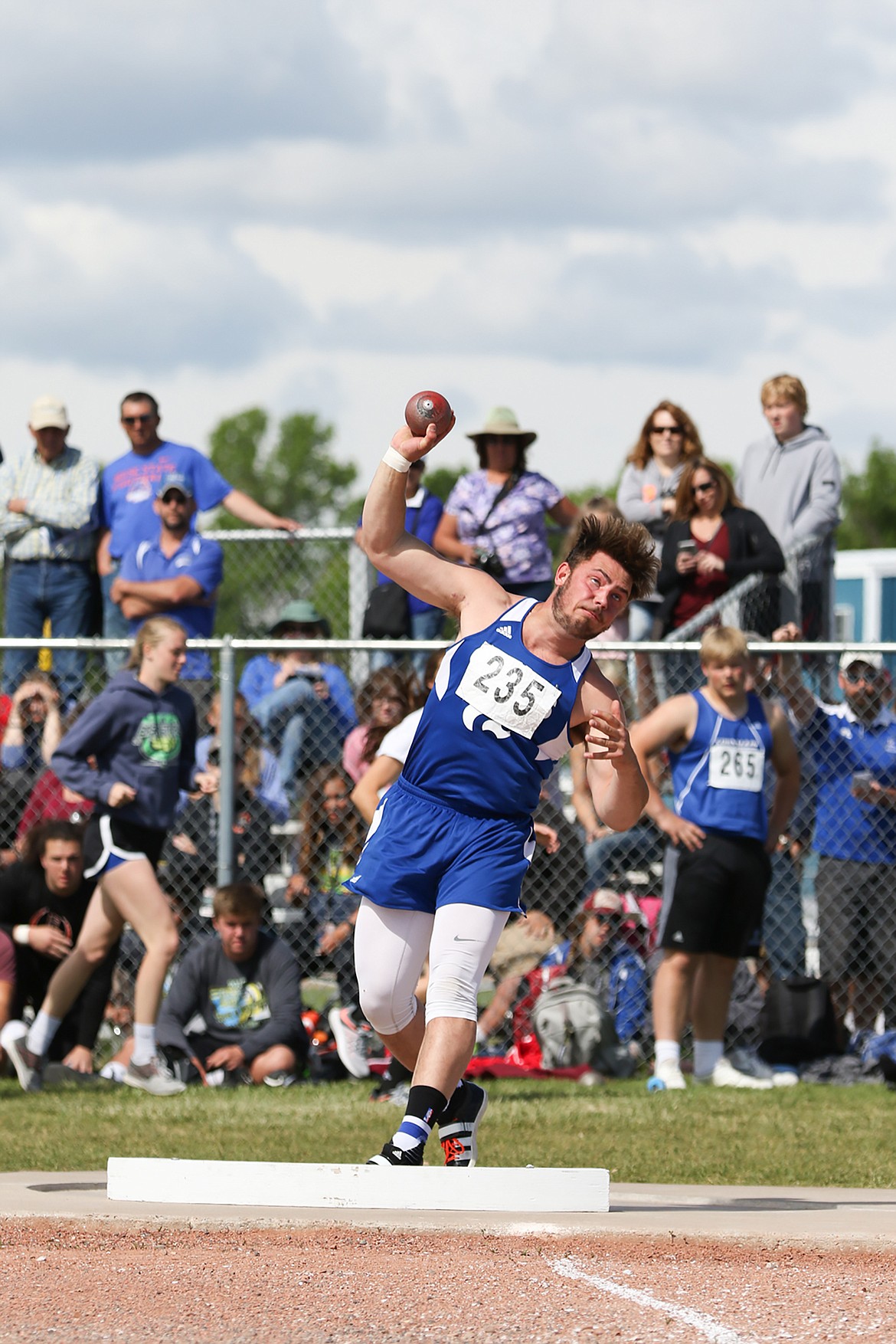 Logan Kolodejchuk throws the shot put at the state A meet in Laurel. (Kylie Richter photo)