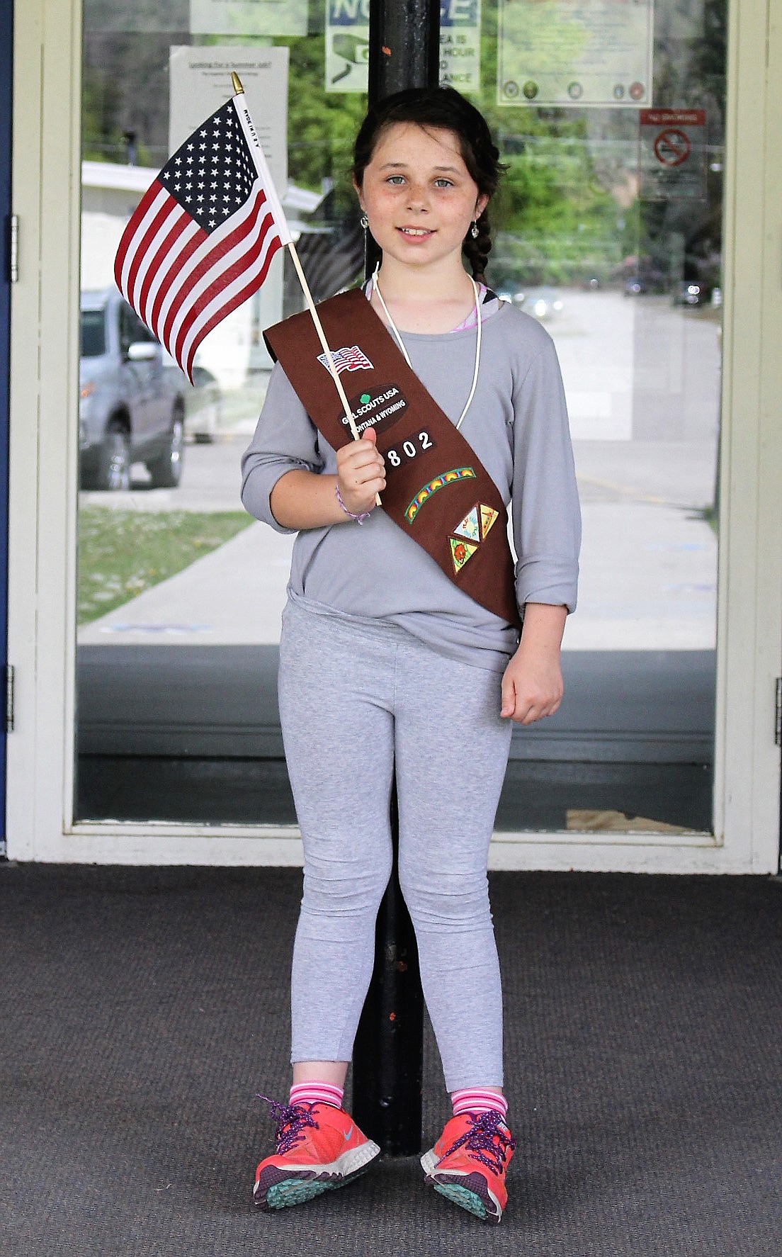 Cami Quick waits outside Superior High School to participate in the Armed Forces Day celebration held on May 20. Her Girl Scout troop helped with the event. (Kathleen Woodford/Mineral Independent).