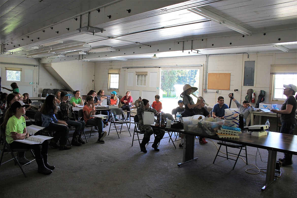 Students meet in the historic tree packing building at Savenac during Outdoor School last week. (Kathleen Woodford/Mineral Independent).