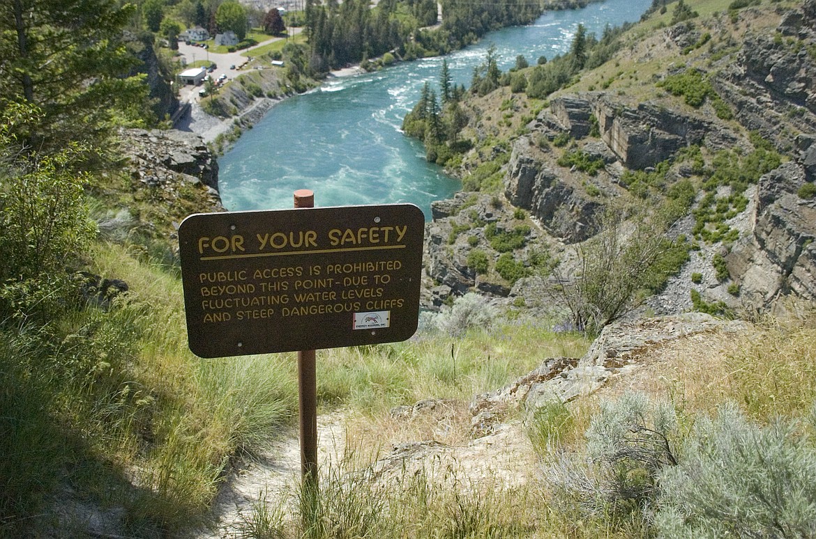 The area below the Selis Ksanka Dam Overlook, where a man reportedly slipped into the Flathead River Wednesday afternoon, is closed due to swift water and treacherous slopes. (Brett Berntsen/Lake County Leader)