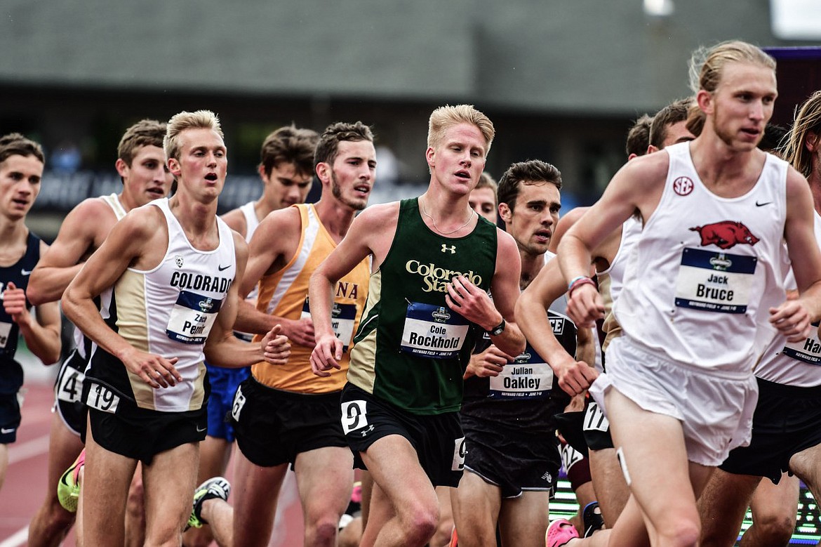 Colorado junior Zach Perrin (19) runs with the lead pack during the 5,000-meter finals at the NCAA outdoor track and field national championships on Friday at Hayward Field in Eugene, Ore. Perrin, a 2013 Flathead High School grad, finished in 11th place in 14:41.50.(TracktownPhoto.com photo)