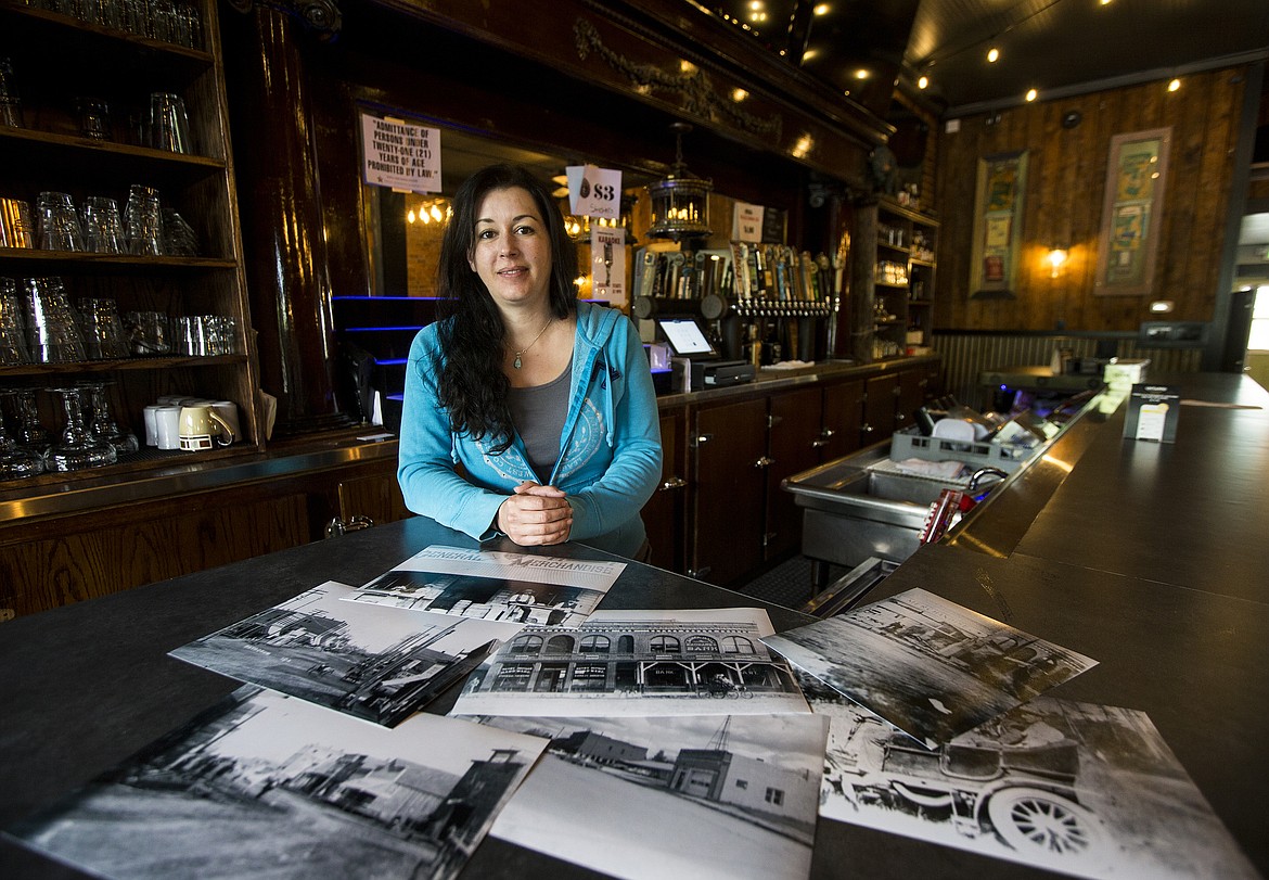 LOREN BENOIT/Press
Danielle Howell, co-owner of Westwood Brewing Co. in Rathdrum, poses for a portrait on June 2 with historic photos of the brewery. The building has been a bank, cafe, inn, saloon, steakhouse and other businesses.