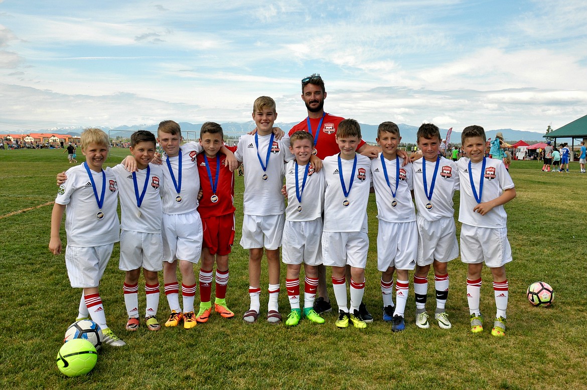 Courtesy photo
The Sting Timbers FC &#146;06 boys Green won the gold division U11 championship at the Three Blind Refs soccer tournament last weekend in Kalispell, Mont. From left are Austin Proctor, Ethan Hickok, Logan Delbridge, Braden Latscha, Max Entzi, Connor Jump, Ben Hannigan-Luther, Jaben Cline, Kason Pintler and Owen Hickok; and rear, coach Nick Pintler. Not pictured is Nathan Ringger.