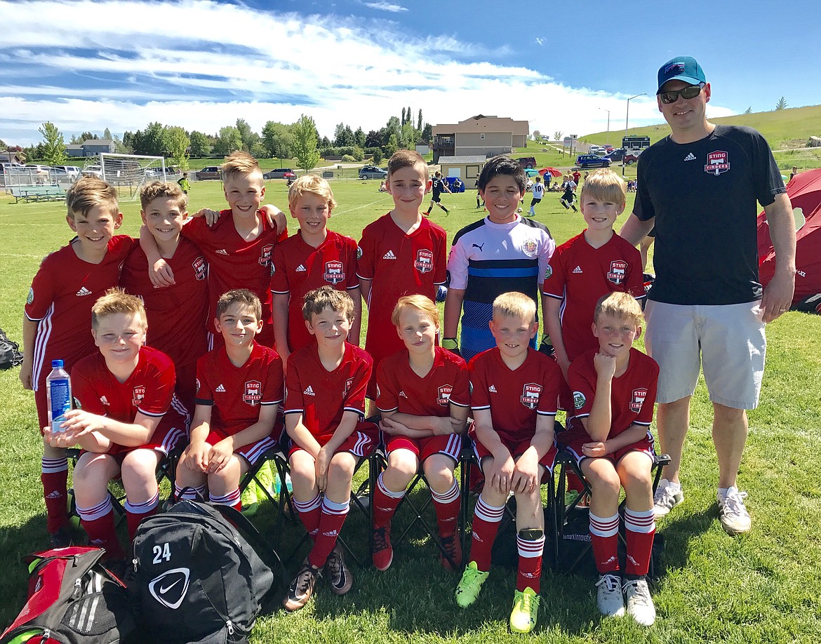 Courtesy photo
The Sting Timbers FC &#146;06 Boys Yellow soccer team won first place in their division at the Three Blind Refs tournament last weekend in Kalispell, Mont. The first game was a win over the opposing team that forfeited by not showing up. Saturday evening the Sting won 7-2 over the Missoula Strikers White. Kai Delio scored 2 goals. Landon Miller had 1 goal and 2 assists. Gavin Samayoa had 1 goal and 1 assist. Jensen Elliott, Jacob Molina, and Ronan Sternberg each scored a goal. Sunday morning the Sting beat the Sandpoint Strikers 5-2. Jacob Molina scored 3 goals and had 1 assist. Jensen Elliott and Ronan Sternberg each scored a goal. Eli Scarola had an assist. In the championship game, the Sting defeated Montana Rush White 6-0. Kai Delio scored 3 goals. Gavin Samayoa, Jensen Elliott, and Ari Rumpler each scored a goal. Jacob Molina had 2 assists and Ronan Sternberg had 1 assist. Rafael Rubio was goalkeeper throughout the tournament. In the front row from left are Jensen Elliott, Ari Rumpler, Graysen Storey, Ronan Sternberg, Evan Misiuk and Landon Miller; and back row from left, Lachlan May, Gavin Samayoa, Jacob Molina, Harper Barlow, Kai Delio, Rafael Rubio, Eli Scarola and coach JJ Barlow.