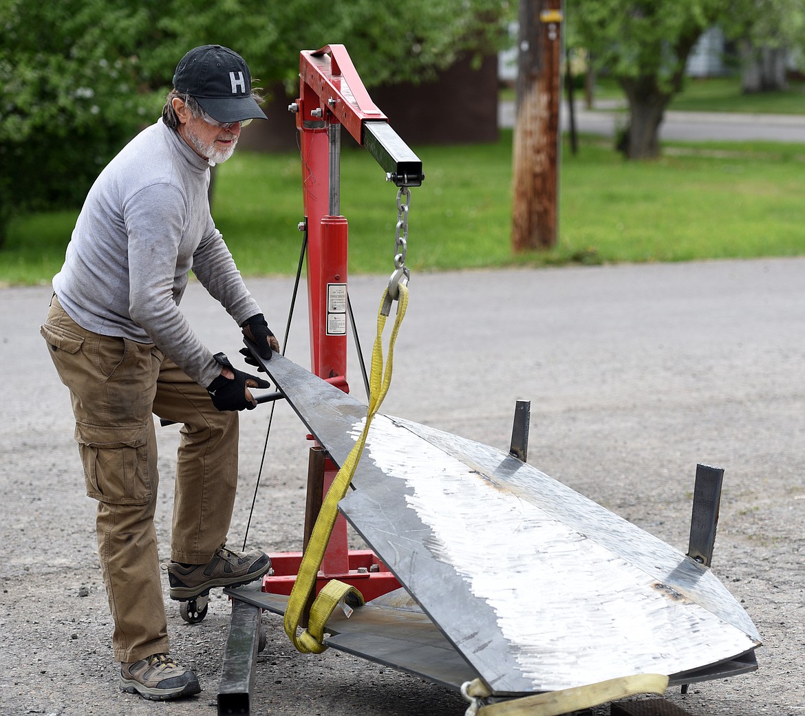 MANEL &Agrave;LVAREZ, working with the hindquarters of one of three iron bison he is building on Wednesday, May 24, in Kalispell. (Brenda Ahearn/Daily Inter Lake)