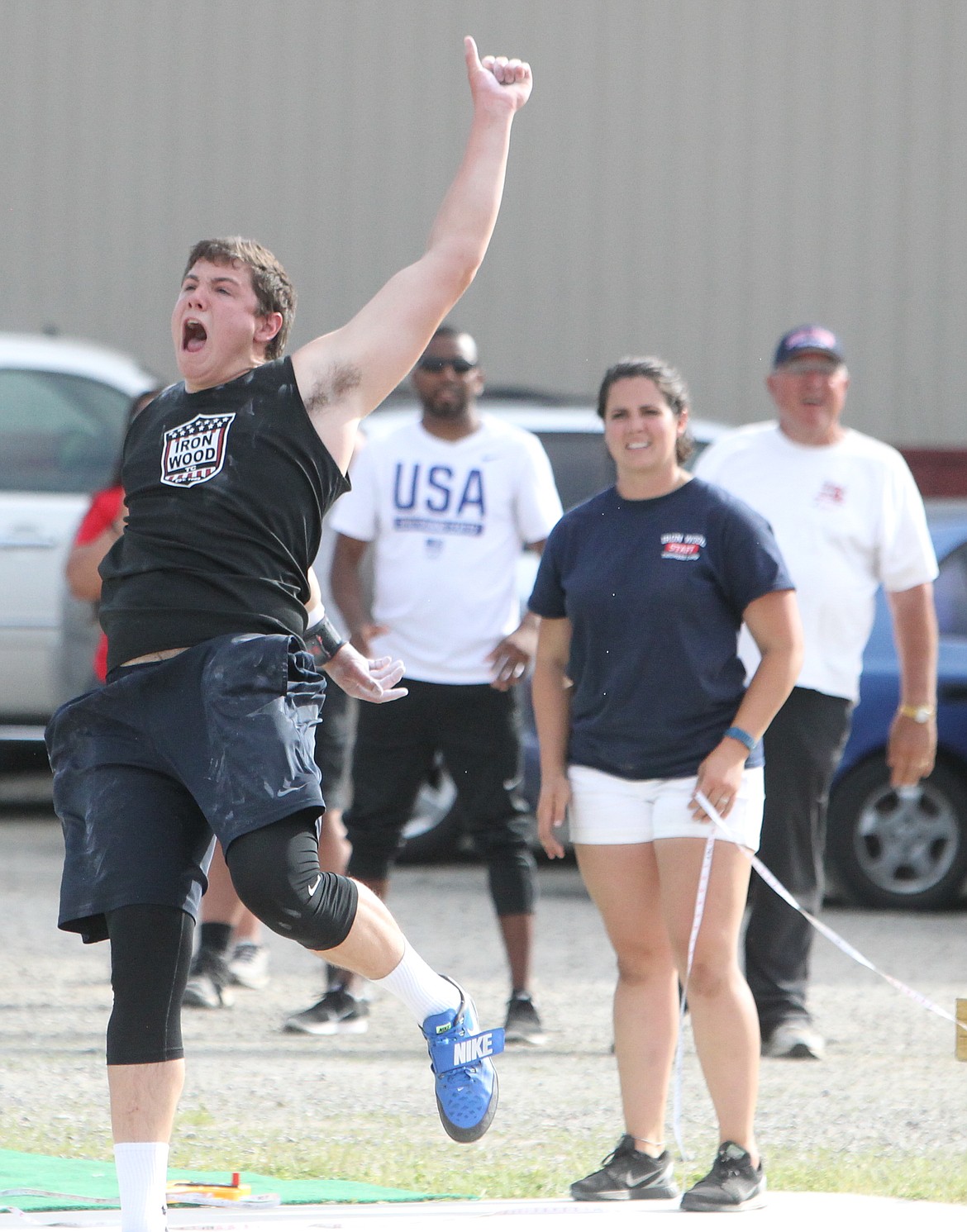 JASON ELLIOTT/Press
Coeur d&#146;Alene High senior Grady Leonard celebrates after landing the top mark of 63 feet, 11 3/4 inches on his second of six attempts in Saturday&#146;s IronWood Throws Classic.