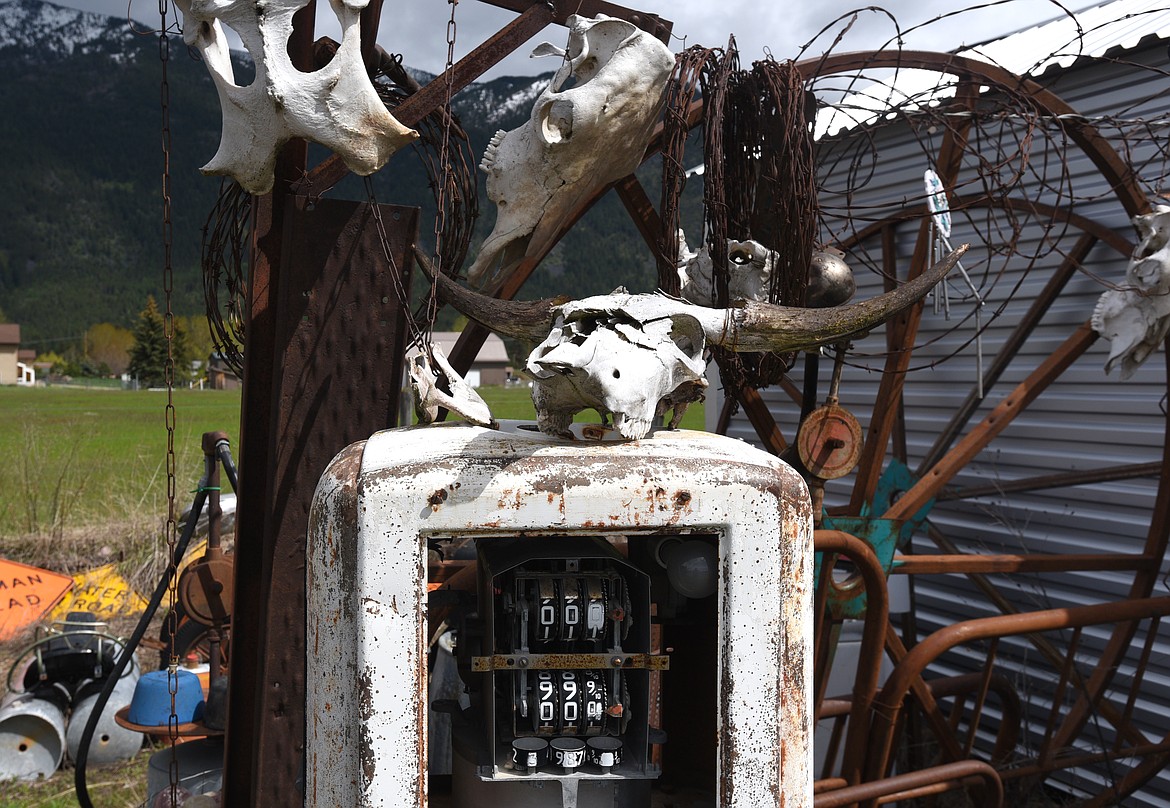 A skull sits atop a dilapidated gas tank in the cemetery at Peddler'z Village. (Aaric Bryan/Daily Inter Lake)