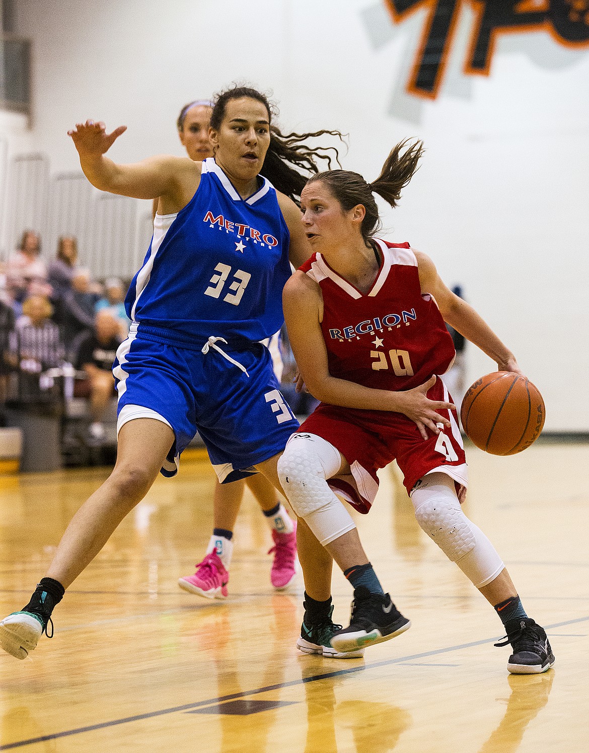 LOREN BENOIT/Press
Timberlake&#146;s Allison Kirby (20) of the Region All-Stars drives to the basket while defended by the Metro All-Stars&#146; Jacinta Buckley of Lewis and Clark on Thursday evening at Post Falls High School.