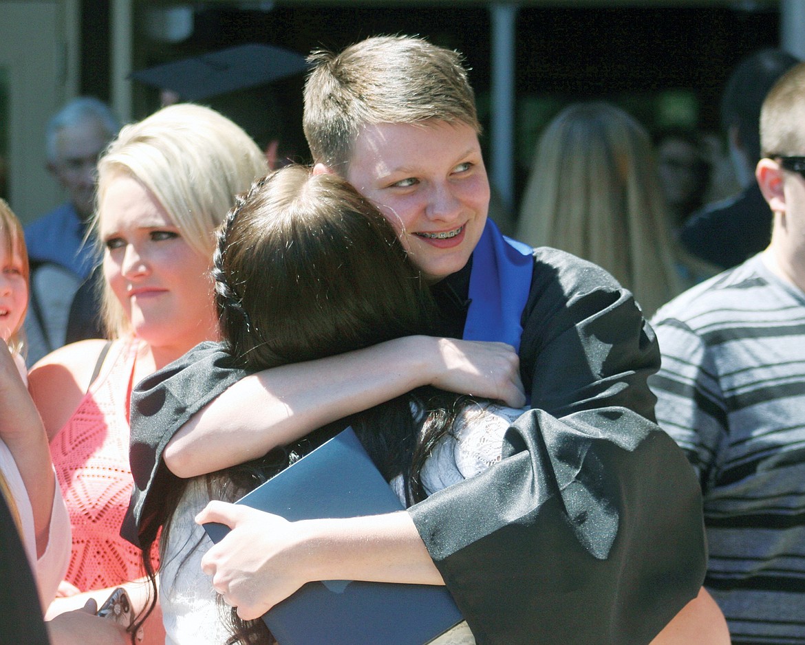 Graduate Miranda Cripe  is  greeted  outside the gym at Libby&#146;s graduation on Saturday, June 3. (Elka Wood/The Western News)
