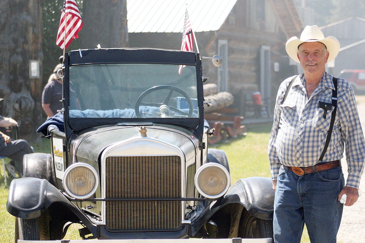 Museum volunteer John Schneider with the Model T he bought for $10 as a sophomore in high school.