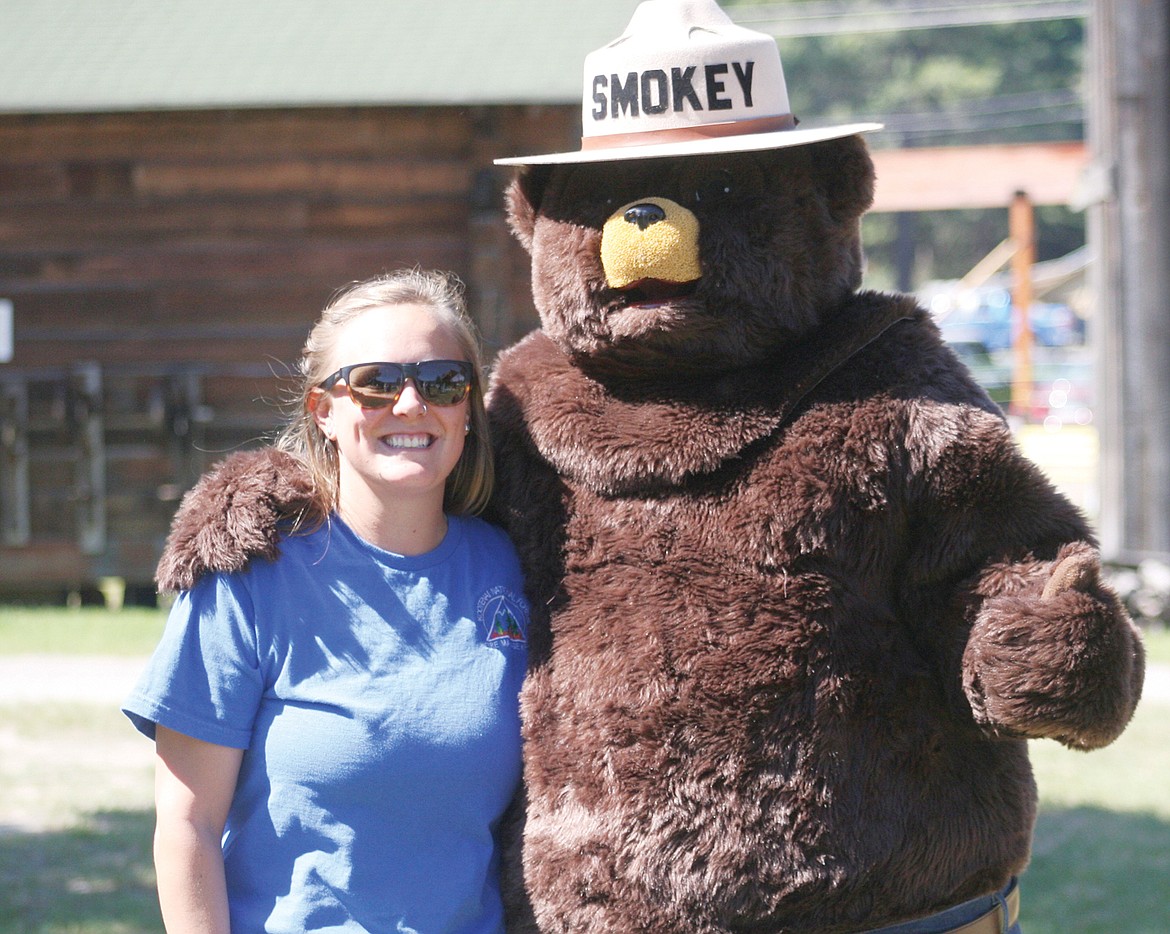 Forest service employee Paige Hageness and Smokey Bear at Libby museum&#146;s grand opening on Saturday.