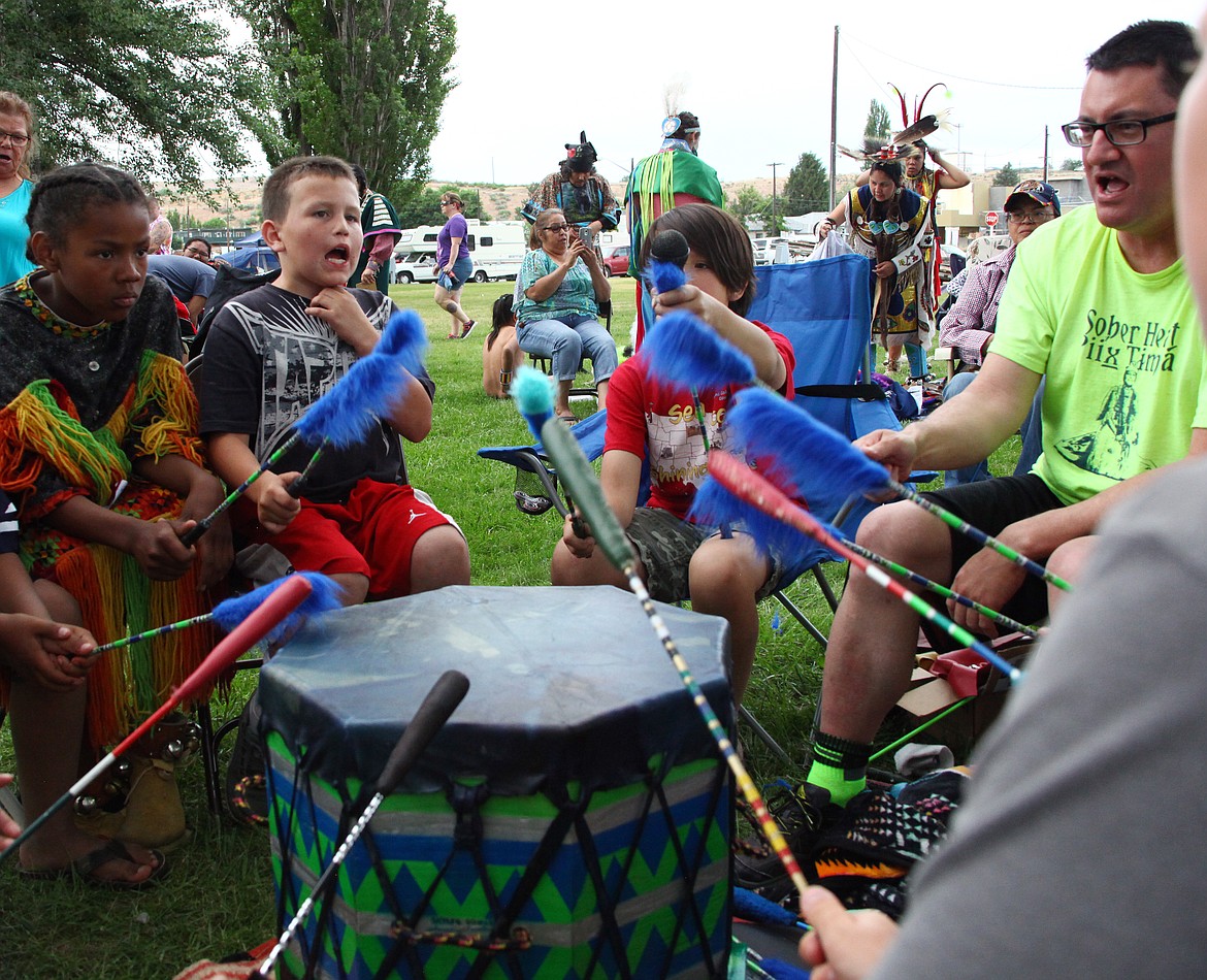 Rodney Harwood/Columbia Basin Herald
Members of the drum group Shunkaha Napm play during the fifth annual Soap Lake Powwow on Saturday at Smokiam Park. The group is named after an ancestor of drumkeepers Skyler Dogskin and Nathan Bob.