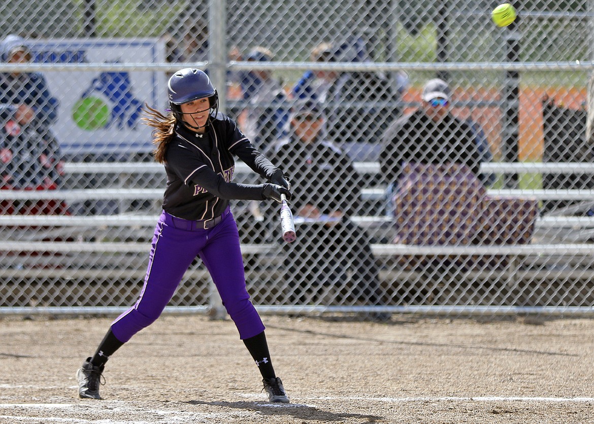 POLSON HIGH School softball player Hannah Fryberger sends a shot in the outfield in the Class-A state softball tournament May 25-27 in Sidney. (Photo courtesy of Bob Gunderson)