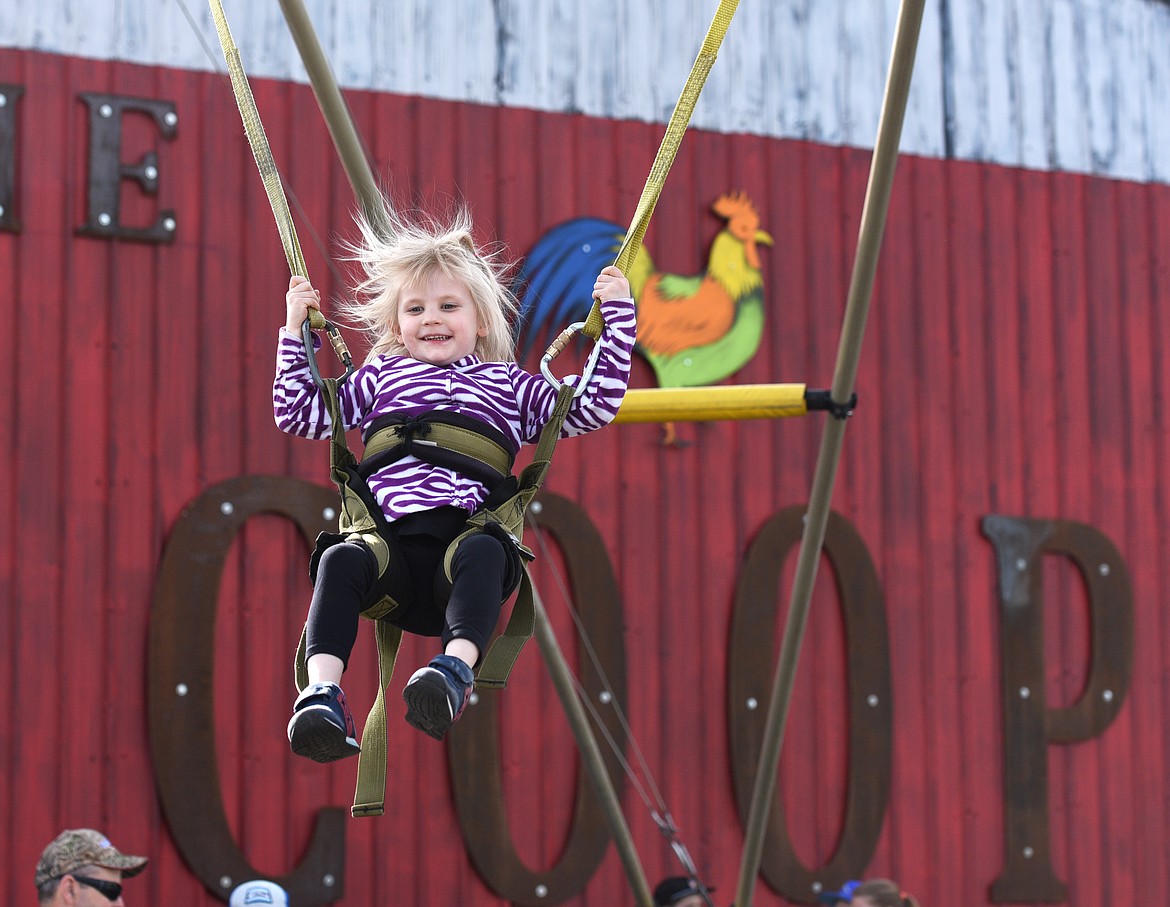 EFIA O&#146;BRIEN bounces on the trampoline at the Columbia Falls Community Market on Thursday, May 25. (Aaric Bryan/This Week in the Flathead)