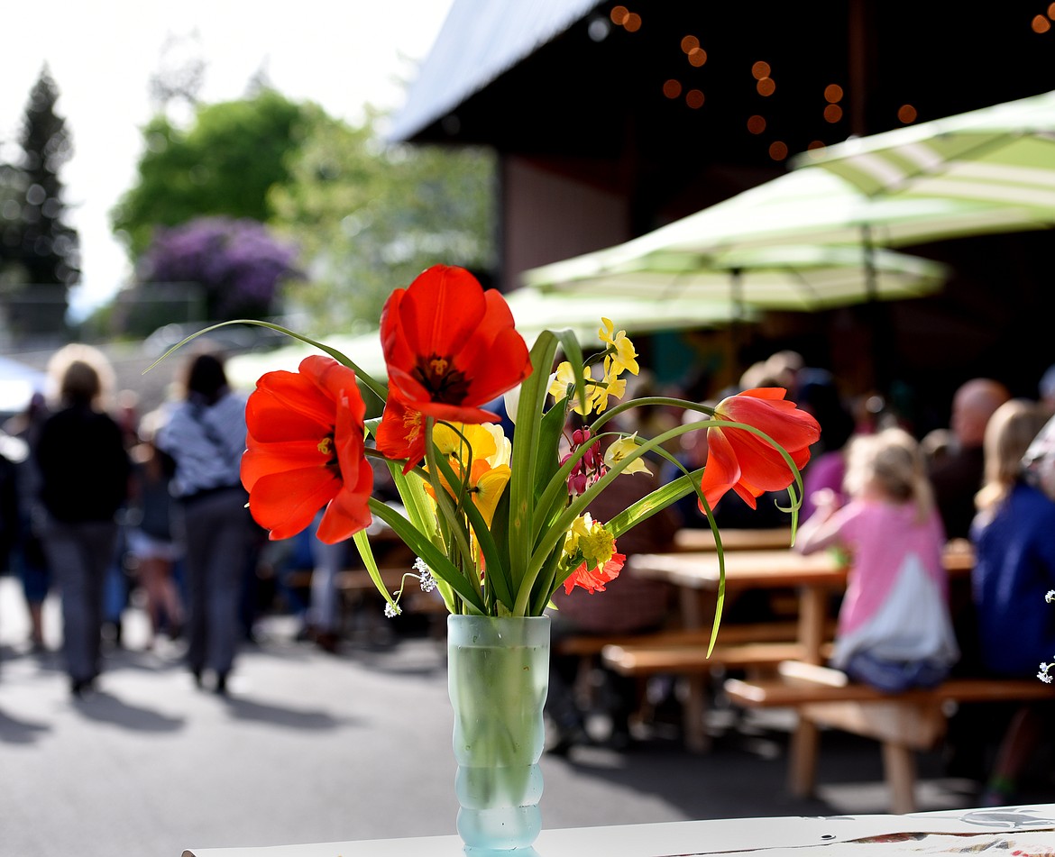 FLOWERS SIT on the Farm Blooms booth at the Columbia Falls Community Market on Thursday, May 25. (Aaric Bryan/This Week in the Flathead)