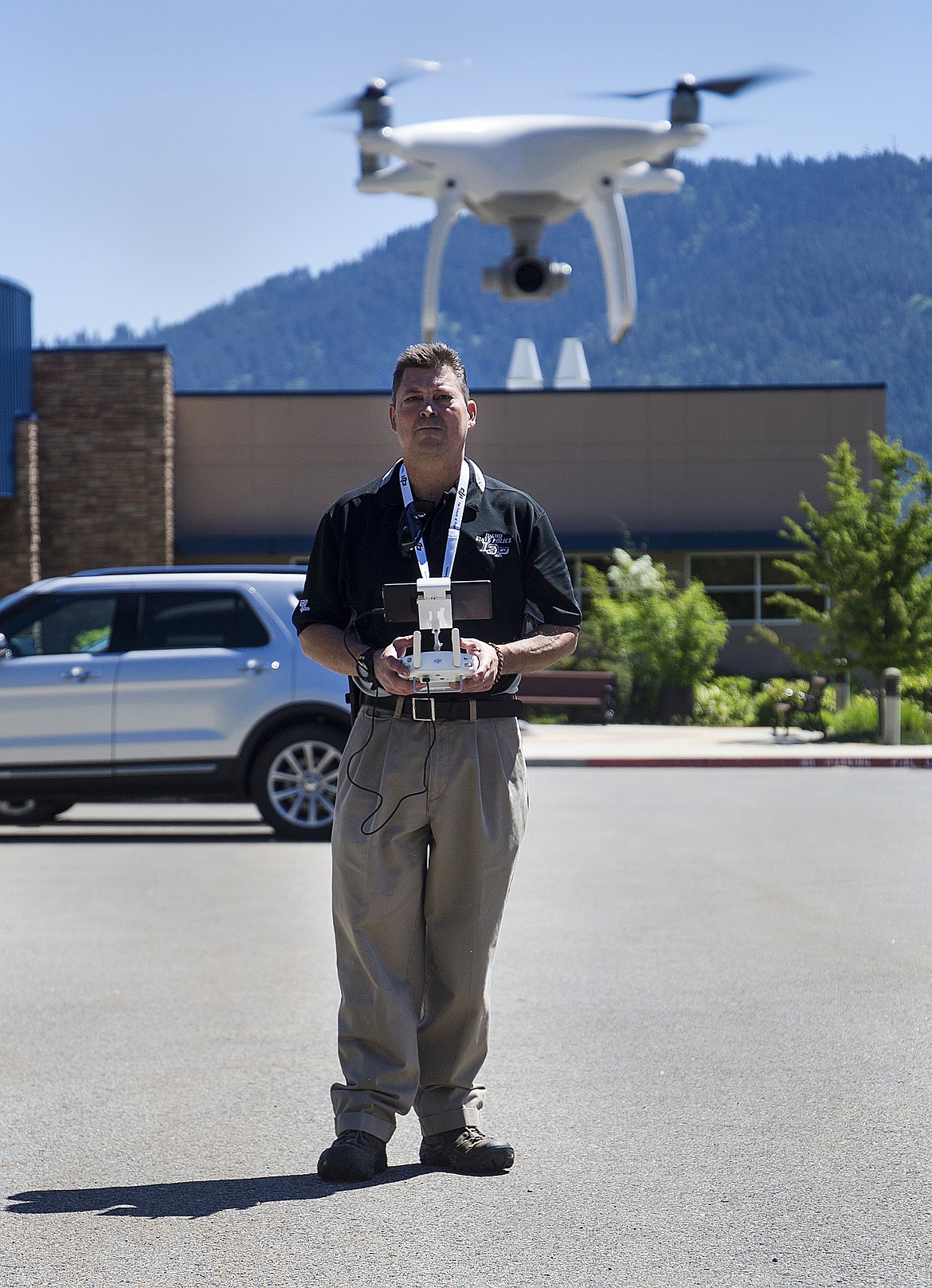 (LOREN BENOIT/Hagadone News Network)
Idaho State Police Lt. Alan Oswald shows how to fly a DJI Phantom 4 Quadrocopter during a recent demonstration at the Idaho State Police District 1 parking lot. ISP has had drones in operation for about a year to help assist with search and rescue, crime scenes and car crashes.