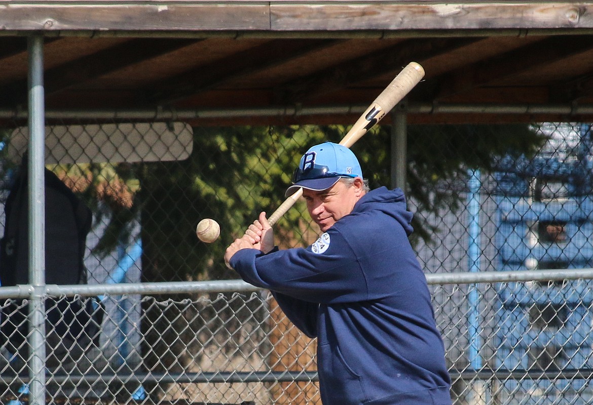 Photo by MANDI BATEMAN
Coach, Tom Turpin, helping his team warm up.