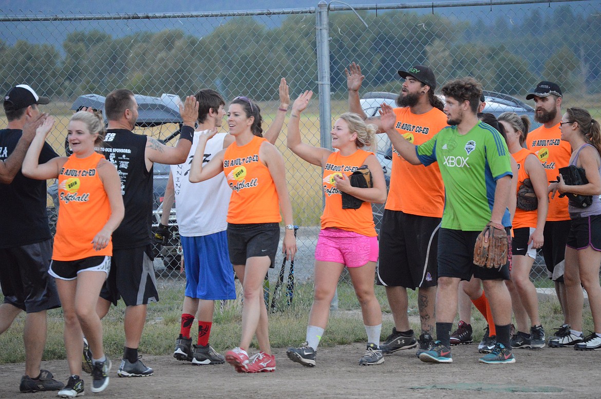 Courtesy photos
The 9B Co-Ed Softball League promotes fun and sportsmanship.