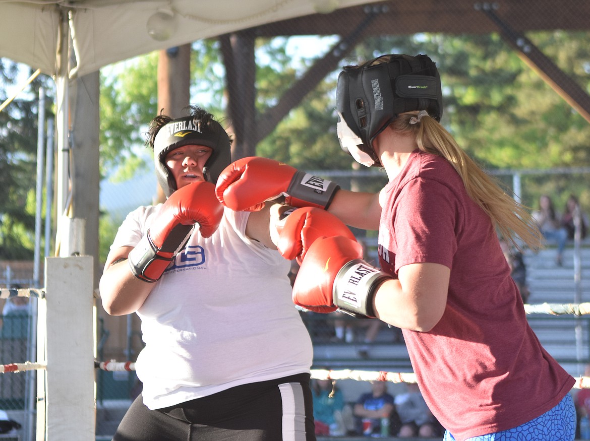 Becca Catina lands a jab against Jamie Seirs before a first round TKO win Monday night.