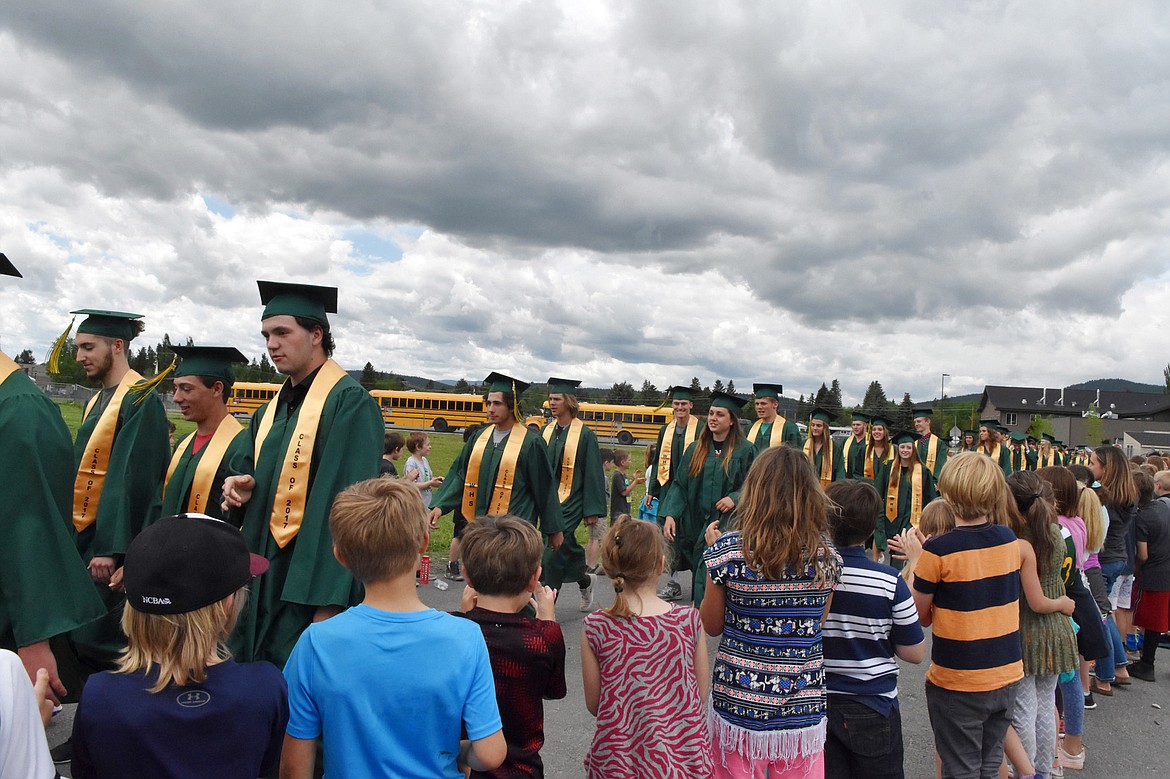 Whitefish High School graduates from the Class of 2017 walked through Muldown Elementary School and Whitefish Middle School Friday afternoon to rounds of applause and high fives. The high school hopes to make the event an annual tradition.