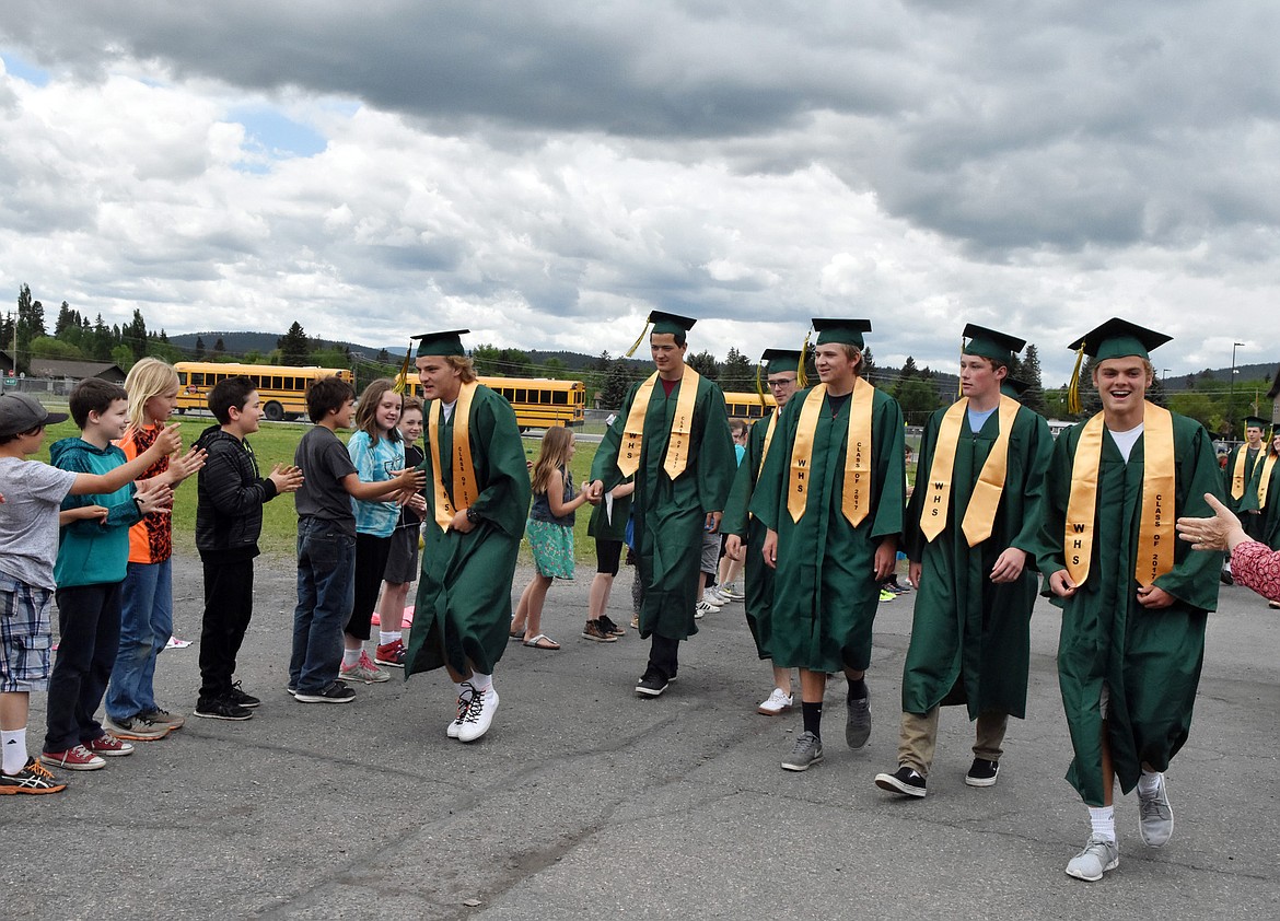 Whitefish High School graduates from the class of 2017 walked through Muldown Elementary School and Whitefish Middle School Friday afternoon to rounds of applause and high fives. The high school hopes to make the event an annual tradition.