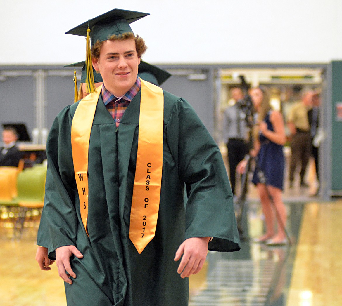 Tucker Blake makes his way to the stage June 3 during the Whitefish High School commencement ceremony at the high school gym.