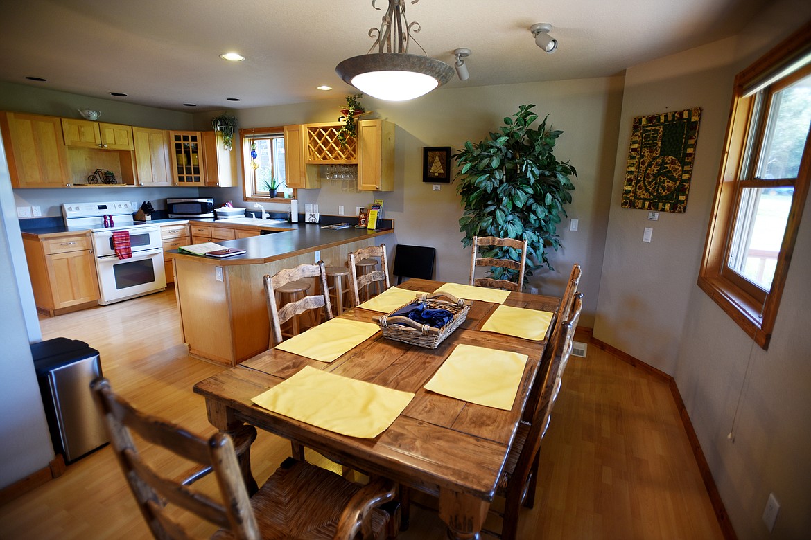 Kitchen and dining room of the guest quarters at Spoke and Paddle in Somers.(Brenda Ahearn/Daily Inter Lake)