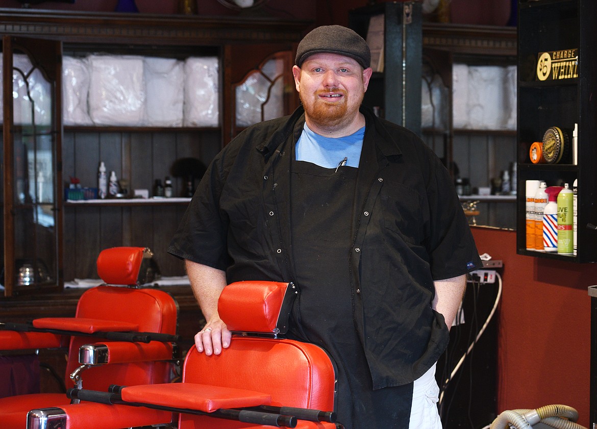 Master Barber Bobby Beeman stands by a chair in his Big B&#146;s Barbershop and Shaving Parlor in Lakeside. (Aaric Bryan/Flathead Journal)