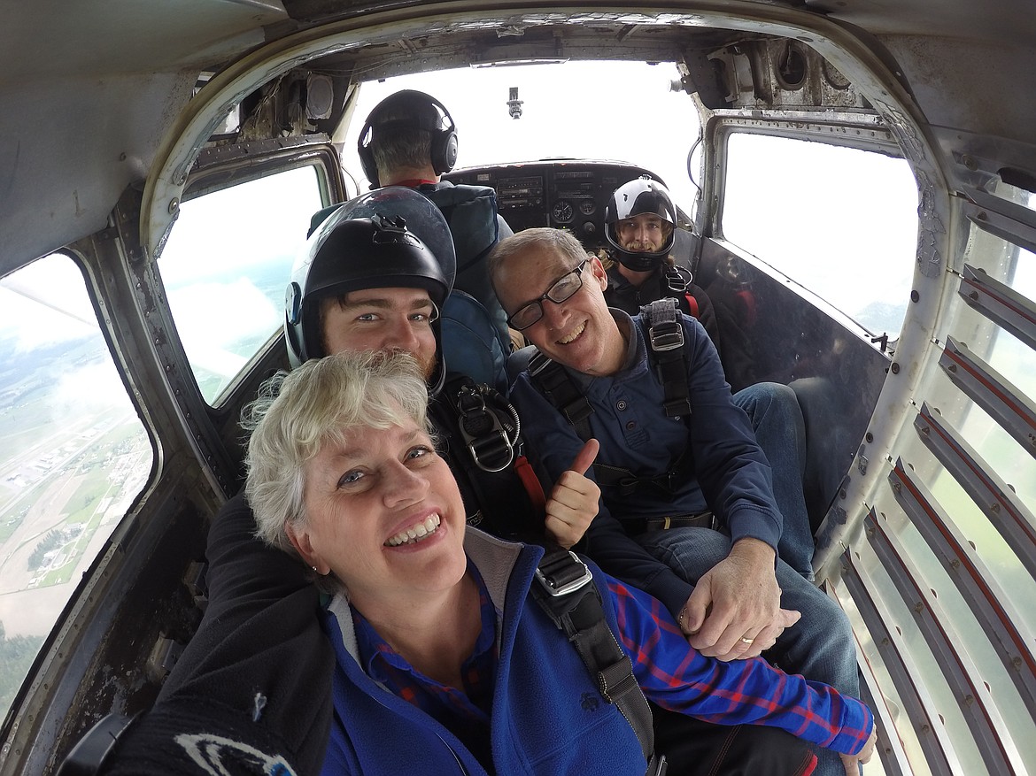 Jumpers take a photo together as they wait for the Cessna 206 to reach an altitude of 10,000 feet before they jump.