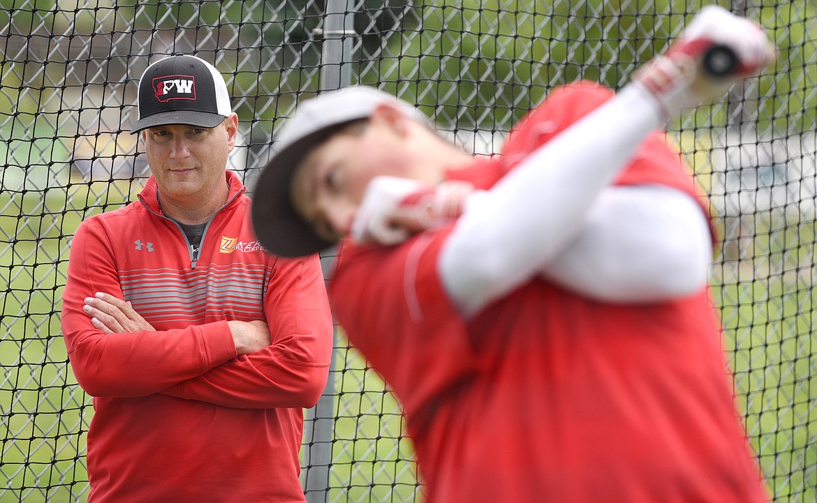 Lakers manager Ryan Malmin instructs hitters during batting practice on Friday. (Aaric Bryan/Daily Inter Lake)