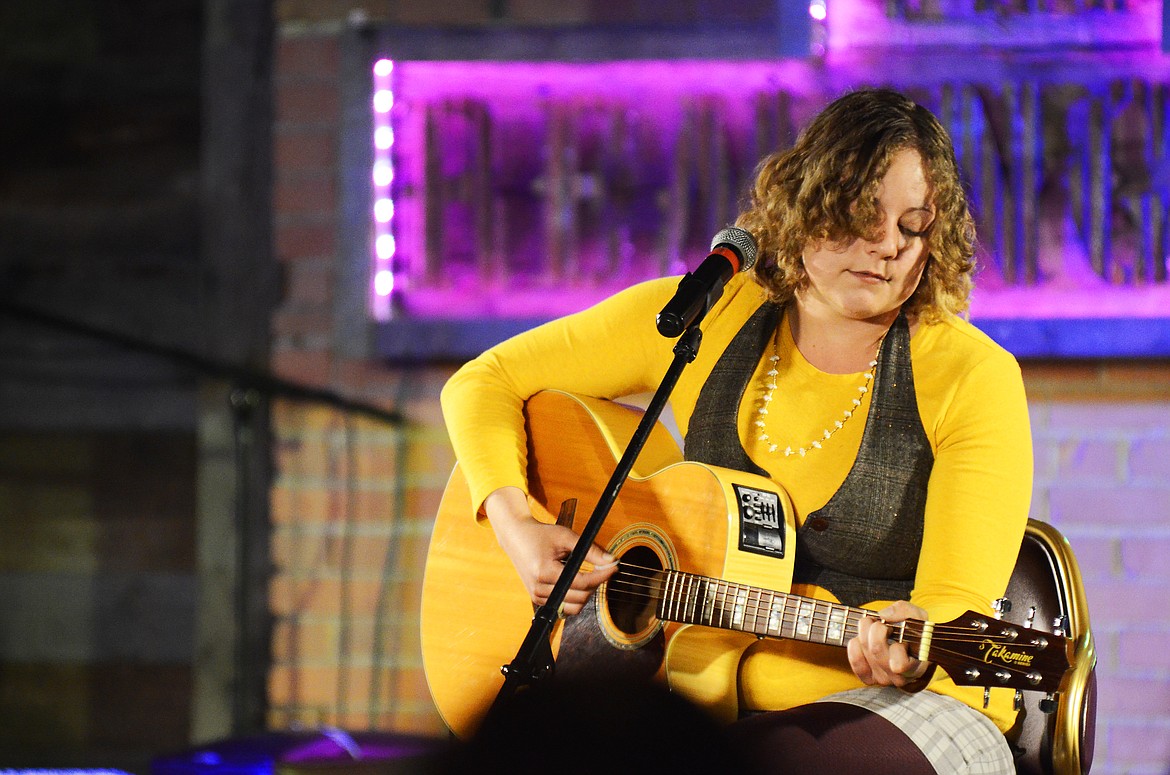 Shantel Bolks sings and plays guitar at a talent show at the Remington Bar and Casino in downtown Whitefish on June 13. (Matt Baldwin/Daily Inter Lake)