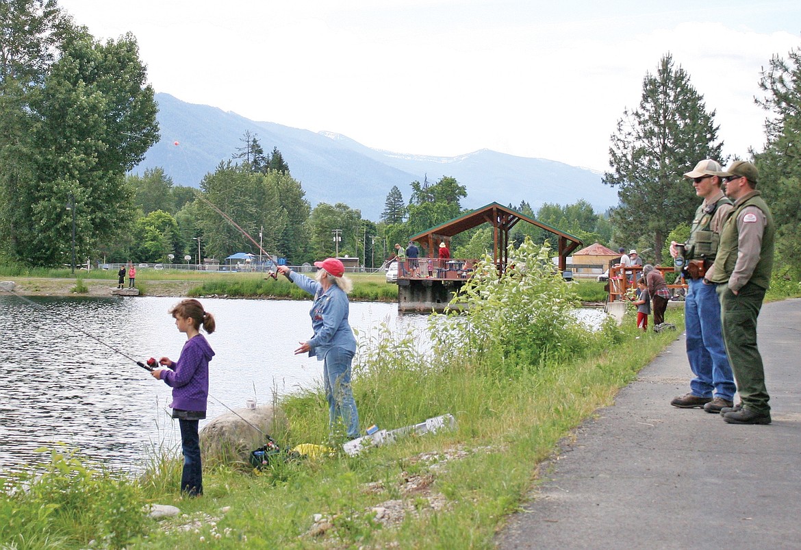 Game wardens and Fish, Wildlife and Parks employees were on hand to offer help and advice at Troy&#146;s kids fishing day on Saturday.  (Elka Wood/The Western News)