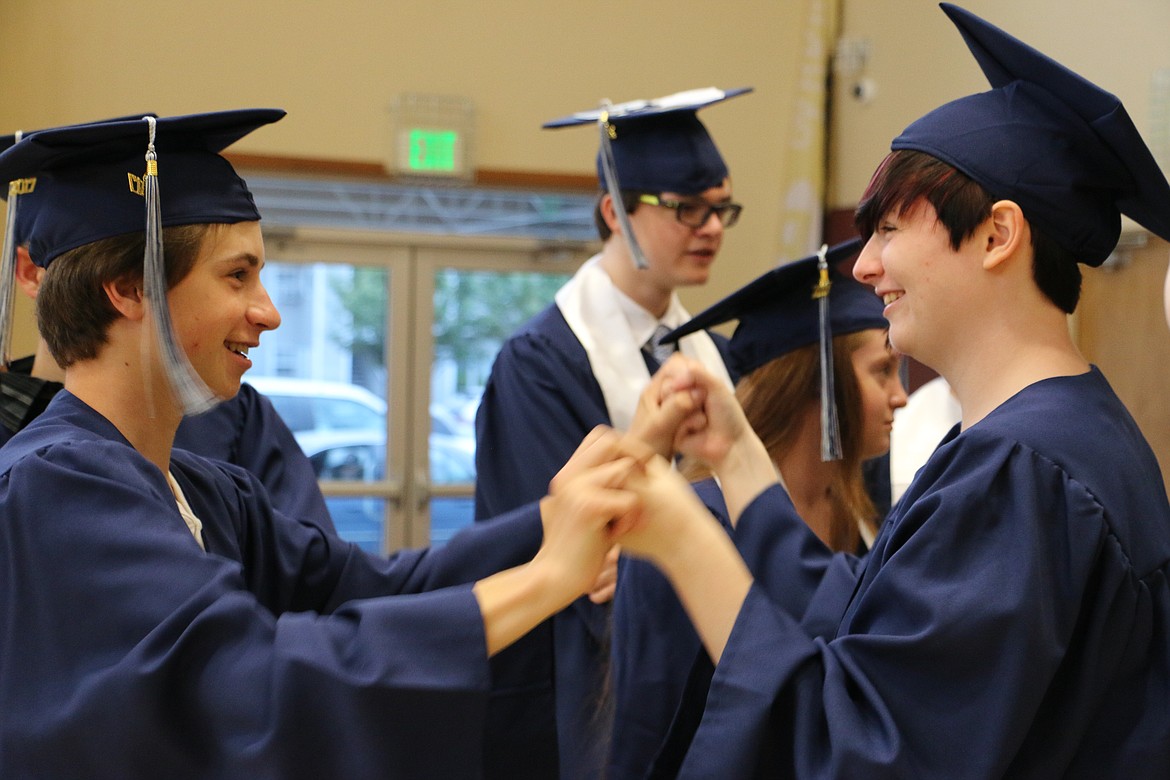 (Photo by MARY MALONE)
Forrest Bird Charter School graduates Patrick Sherman, left, and Ericka Moore, right, were being a bit goofy as they waited for Saturday's graduation ceremony to begin.