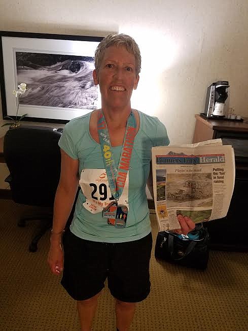 Courtesy photo
Jan Klopfenstein took the Herald to the Coeur d&#146;Alene Marathon on May 28, which she completed.