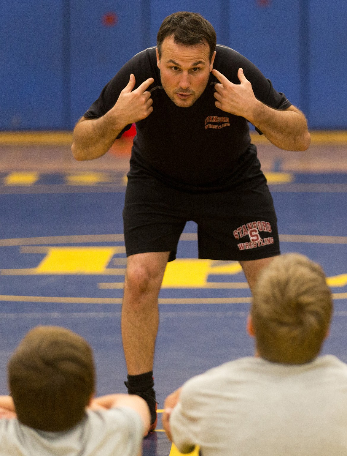Stanford University wrestling coach Jason Borrelli coaches Libby-area wrestling students during the Greenchain Wrestling Camp at Libby Elementary School on Sunday, June 11, 2017.