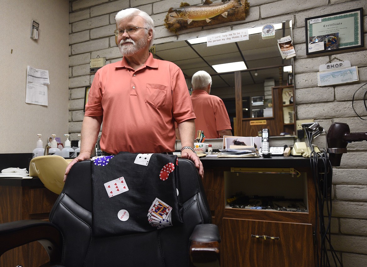 Ron Kelley stands behind his barber chair at the King&#146;s Lair on Thursday. (Aaric Bryan/Daily Inter Lake)