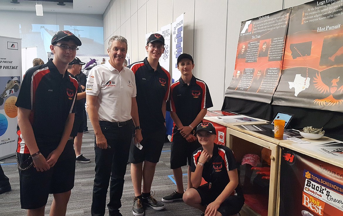 HOT SPRINGS HOT PERSUIT team members take a photo with the founder of Formula 1. (from left): Josh Scrivner, Andrew Denford, founder of Formula-1 schools, Chris Rosler, Raferdy Samson, and Jenny Scrivner. (photo courtesy of Beau Herman)