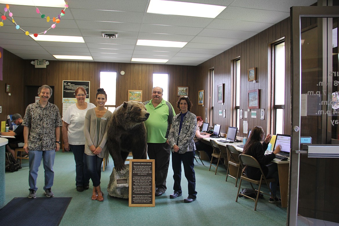 Photo by Tanna Larsen
Boundary County Library staff gather around the iconic library bear.