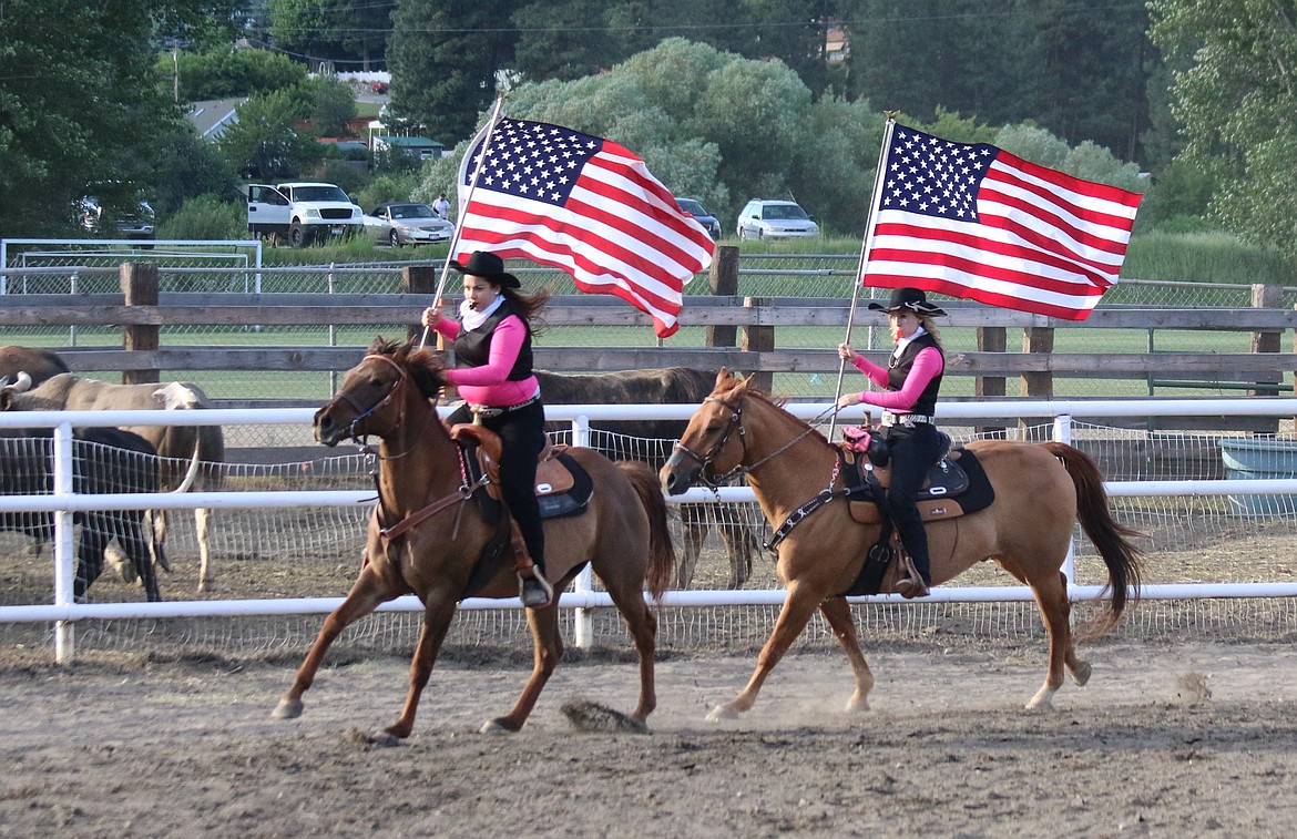 Photo by Mandi Bateman
Mindy Ahner and Mallory Stippich, part of the 9B Riders Drill team, carry the American flag with pride.