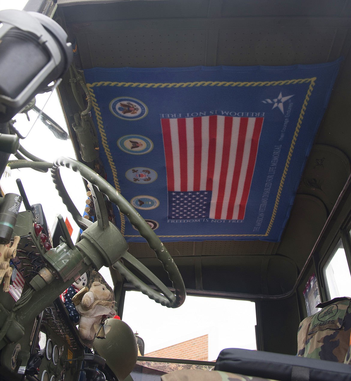 A FLAG honoring all branches of the United States military hangs on the roof inside the cab of Lavel&#146;s truck. (Marla Hall/Clark Fork Valley Press)