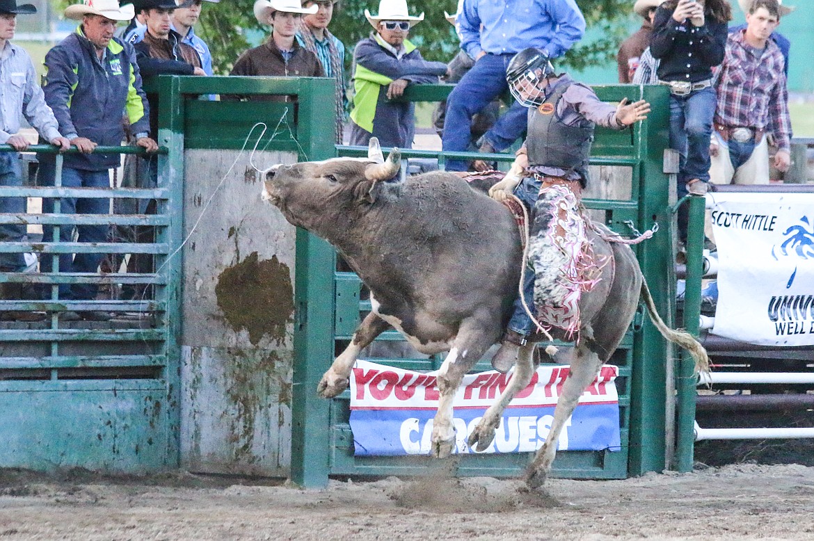 Photos by Mandi Bateman
Hometown bull rider Jesse Luther rides Smokin Dee for a score of 69 points at Friday&#146;s Bull Bash event.