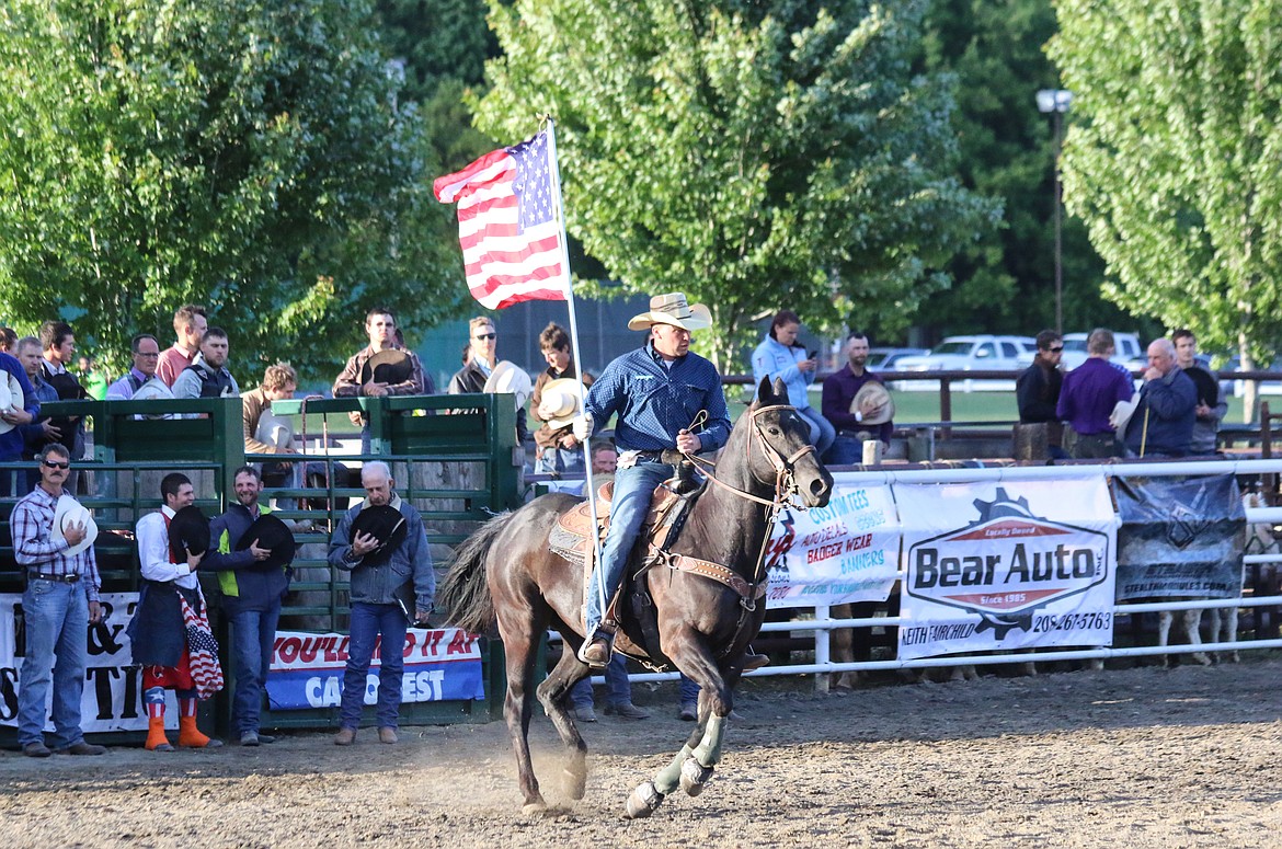 Photo by Mandi Bateman
Andy Rice and the American Flag during the National Anthem.