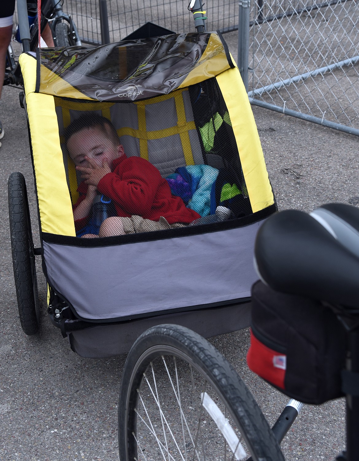 Ethan Henretti sleeps soundly as the family passes through Ronan on their cross-county cycling trip. (Marla Hall/Clark Fork Valley Press)