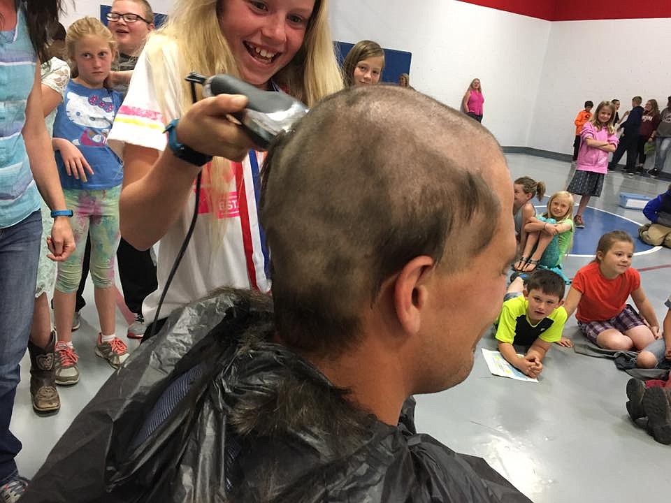 Members of the class lined up to take turns making their mark on school principal Logan Labbe&#146;s head. (Photos courtesy Superior School)