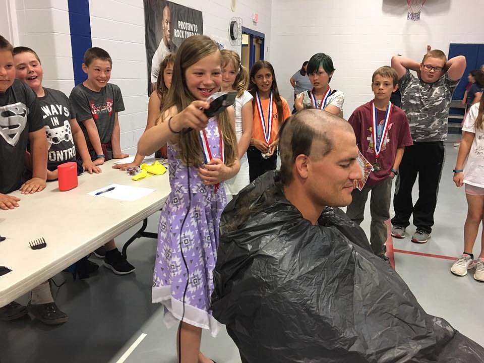 Fourth-grade students from Mrs. Crabb&#146;s fourth-grade class had fun shaving their principal&#146;s head at Superior Elementary School. They won the &#147;Rock Star&#148; award for outstanding behavior.