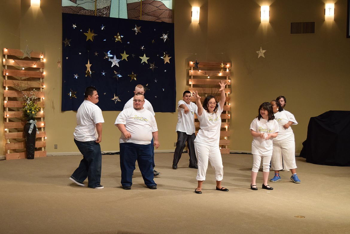 Joel Martin/Columbia Basin Herald
Contestants and escorts jam out to the opening number of the Special Star Pageant on Saturday.