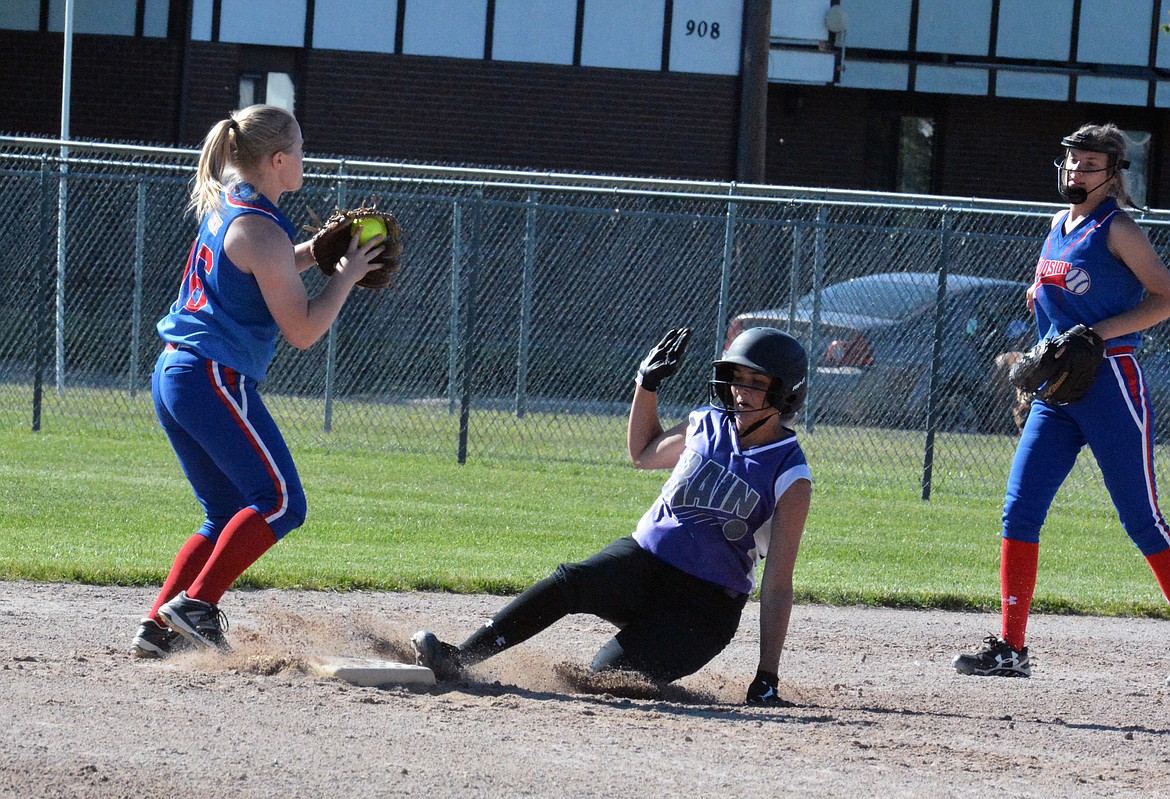 POLSON PURPLE Rain player Paige Noyes slide slides into second base in the 16, 18U Splash Tournament Classic Championship at Polson Softball Complex. (Jason Blasco/Lake County Leader)