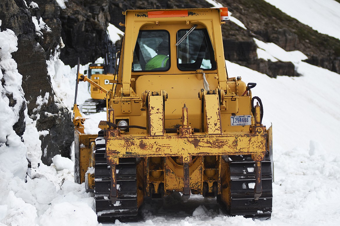 Crews continued to work on the Big Drift east of Logan Pass Friday morning in Glacier National Park.